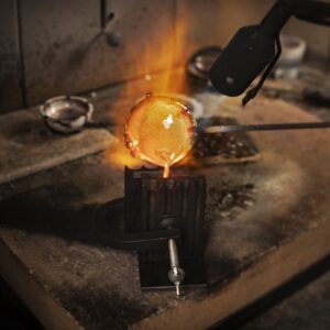 Goldsmith casting metal with a ceramic crucible and crucible holder
